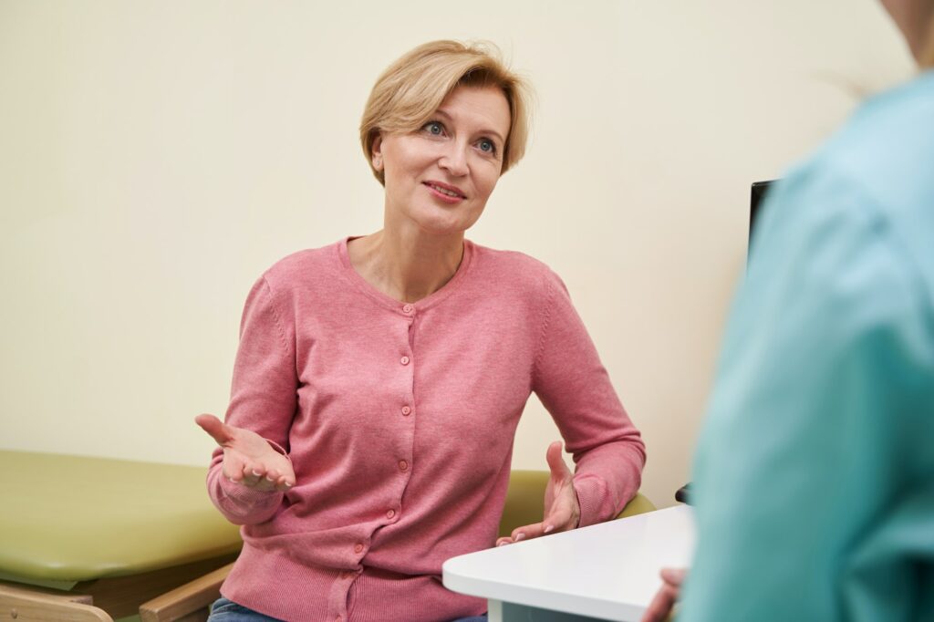 Close up of pretty blonde talking to practitioner